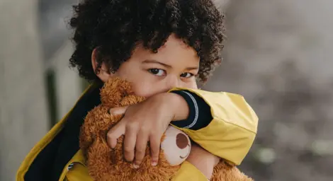young-boy-hugging-a-brown-soft-bear