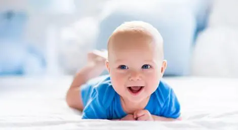 happy-smiling-baby-in-blue-clothes