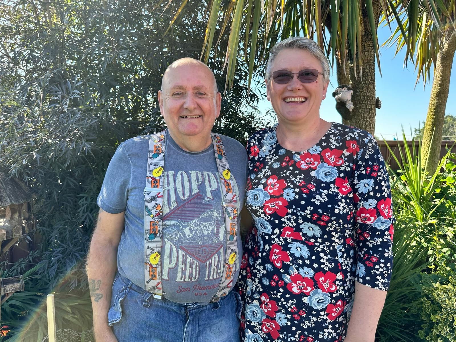 Kevin and Andrea are standing together and smiling at the camera