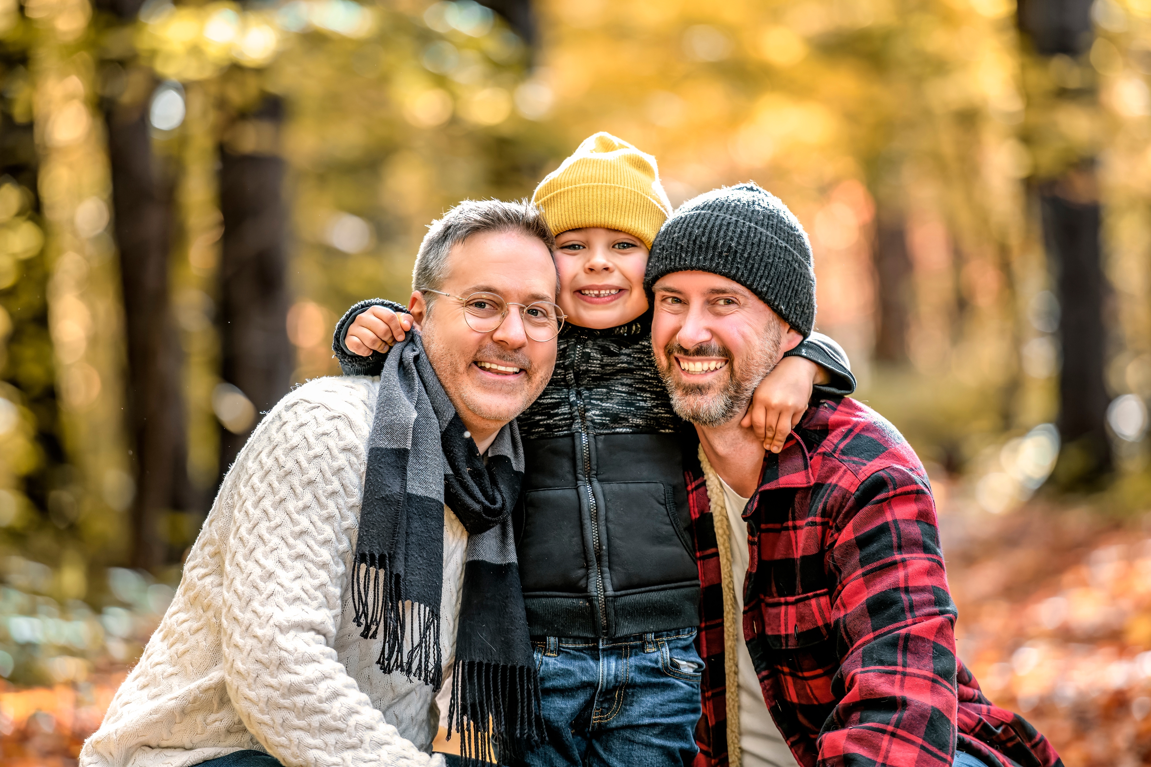 two-men-outdoors-with-little-boy-standing-between-them